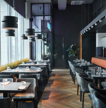 rows-of-restaurant-tables-and-chairs-in-gray-room-2021-09-24-04-18-51-utc-1